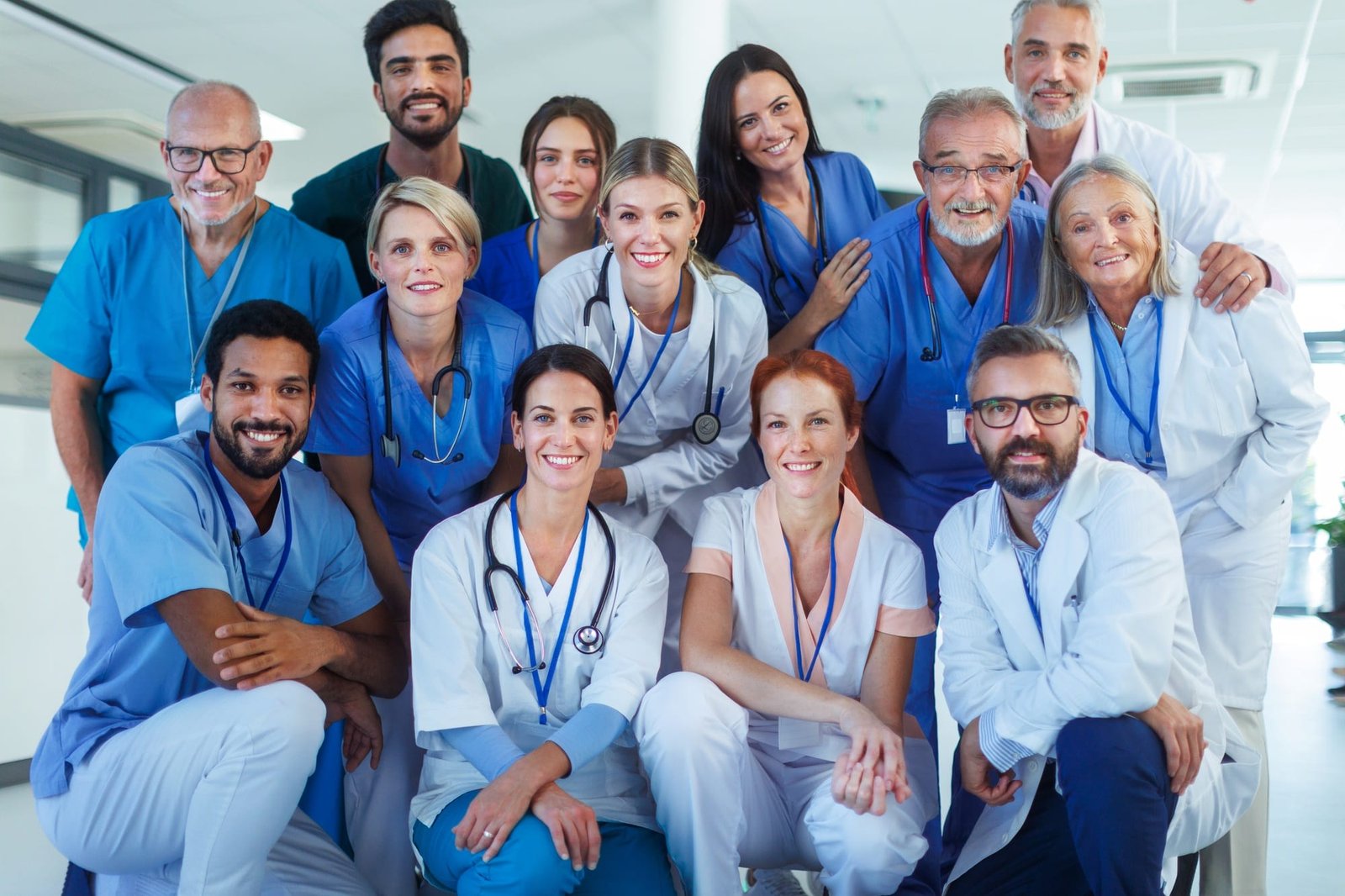 Portrait of happy doctors, nurses and other medical staff in hospital.