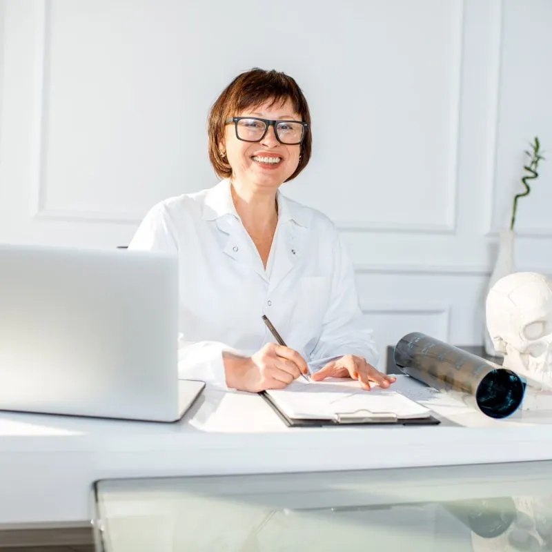 senior-woman-doctor-in-the-office.jpg